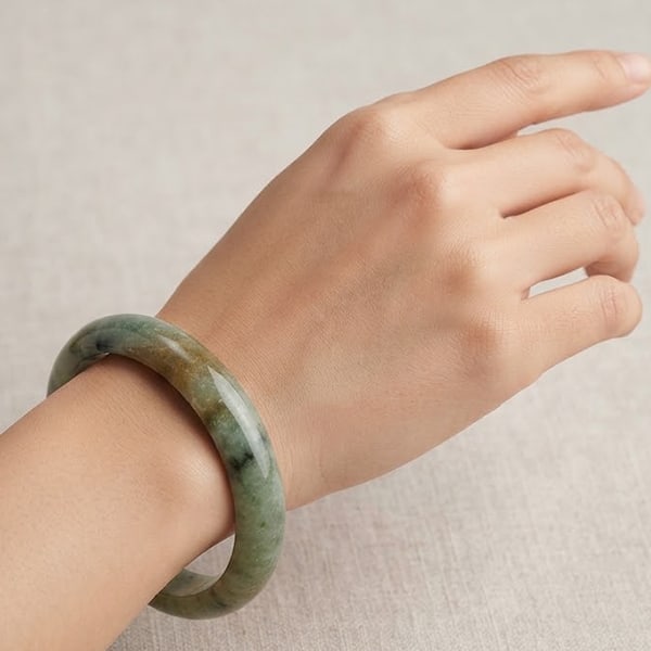 Natural Multi Color Green Jade Gemstones 319.13 Ct. Bangle Round Cabochon Shape Diameter 55 Mm.: Product ID: 819808049 Product Name: Natural Jade Weight: 319.13 CT. Size: 70 / 55 / 17 MM. Shape: Round Color: Green Clarity:Opaque Luster: Good Gems Origin: Thailand Treatment: Unheated Crystal Struc
