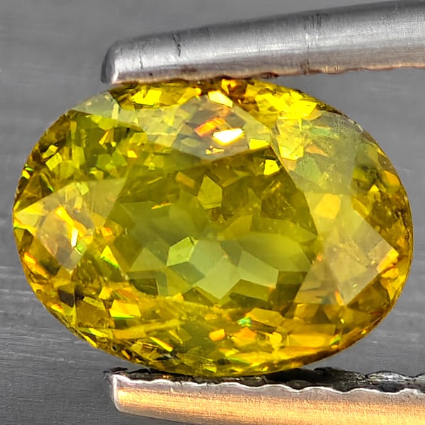Natural Multi-Color With Rainbow Spark Sphene Gemstones 1.26 Ct. Oval Shape 7.6 x 5.8 Mm.: Product ID: 806509102 Product Name: Natural Sphene Weight: 1.26 CT. Size: 7.6 x 5.8 x 3.9 MM. Shape: Oval Shape Color: Multi-Color Clarity:SI1 Luster: Good Gems Origin: Madagascar Treatment: Unheated 