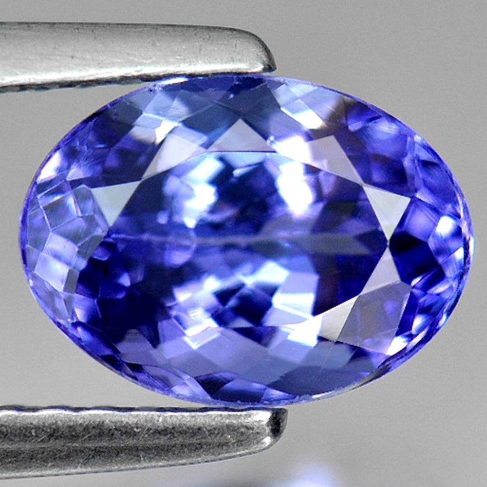 Natural Blue Tanzanite Gemstones 1.89 Ct. Oval Shape 8.5 x 6.2 Mm.: Product ID: 807009080 Product Name: Natural Tanzanite Weight: 1.89 CT. Size: 8.5 x 6.2 x 4.9 MM. Shape: Oval Color: Violetish Blue Clarity:VVS Luster: Good Gems Origin: Tanzania Treatment: Heated Crys