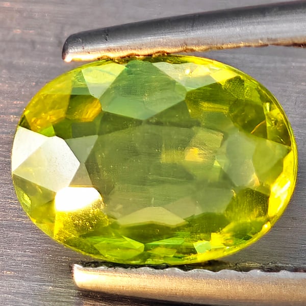 Natural Multi-Color With Rainbow Spark Sphene Gemstones 1.37 Ct. Oval Shape 8.8 x 6.5 Mm.: Product ID: 806509245 Product Name: Natural Sphene Weight: 1.37 CT. Size: 8.8 x 6.5 x 3 MM. Shape: Oval Shape Color: Multi-Color Clarity:SI1 Luster: Good Gems Origin: Madagascar Treatment: Unheated Cr