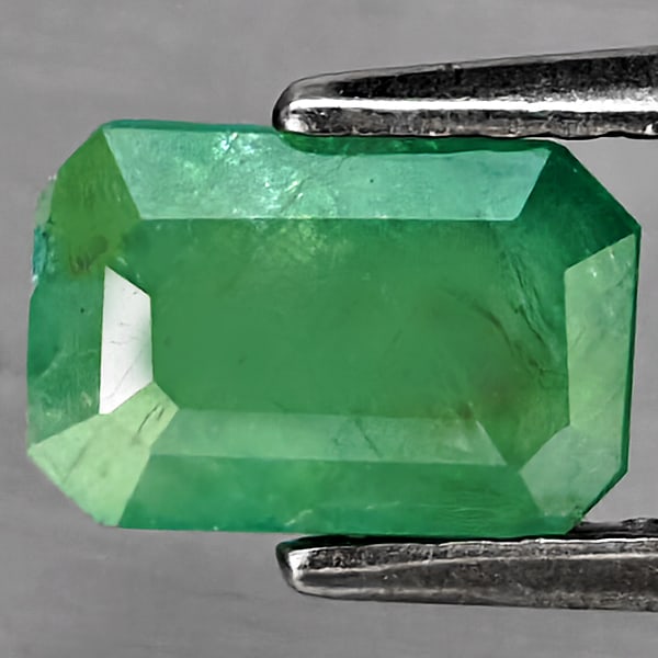 Natural Green Blueish Grandidierite Gemstones 1.09 Ct. Octagon Shape 7.5 x 5 Mm.: Product ID: 803100080 Product Name: Natural Tsavorite Weight: 1.09 CT. Size: 7.5 x 5 x 3.4 MM. Shape: Octagon Color: Green Blueish Clarity:SI1 Luster: Good Gems Origin: Madagascar Treatment: Unheated 