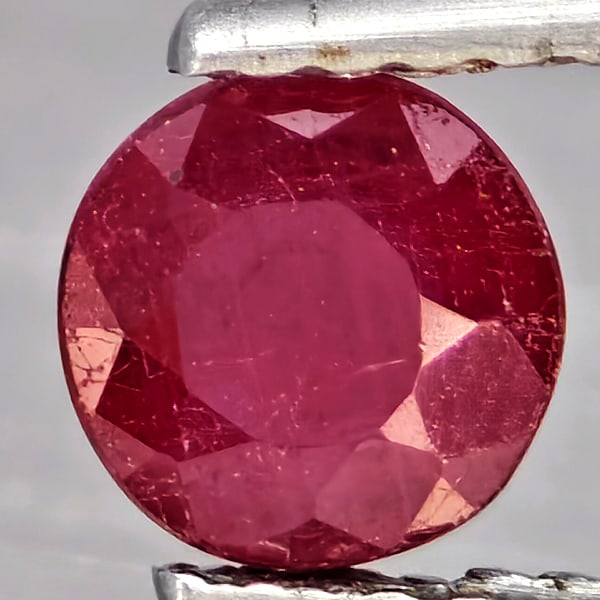 Natural Pinkish Red Ruby Gemstones 0.74 Ct. Round Shape 5.4 Mm.: Product ID: 805935854 Product Name: Natural Ruby Weight: 0.74 CT. Size: 5.4 x 5.4 x 3.9 MM. Shape: Round Color: Pinkish Red Clarity:SI1 Luster: Good Gems Origin: Madagascar Treatment: Heated (Lead-gla