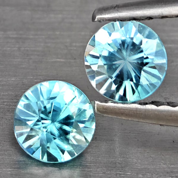 Natural Blue Zircon Gemstones 1.09 Ct. 2 Pcs. Round Diamond Cut 4.7 Mm.: Product ID: 807743260 Product Name: Natural Gemstones Weight: 1.09 CT. Size: 4.7 x 4.7 x 3.3 MM. Shape: Round Diamond Cut Color: Blue Clarity:SI1 Luster: Good Gems Origin: Cambodia Treatment: Heated C
