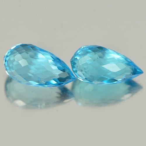 Natural Blue Topaz Gemstones 2.16 Ct. Briolette Shape 7.9 x 4.2 Mm.: Product ID: 807151248 Product Name: Natural Blue Topaz Weight: 2.16 CT. Size: 7.9 x 4.2 x 4.2 MM. Shape: Briolette Color: Blue Clarity:VSI Luster: Good Gems Origin: Brazil Treatment: Treated Crystal S