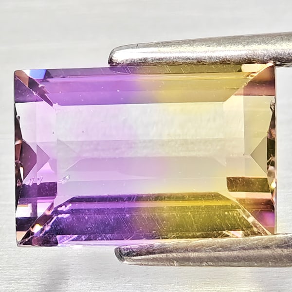 Natural Bi Color Ametrine Gemstones 2.03 Ct. Octagon Shape 9.1 x 6.2 Mm.: Product ID: 800408318 Product Name: Natural Ametrine Weight: 2.03 CT. Size: 9.1 x 6.2 x 4.5 MM. Shape: Octagon Color: Bi Color Clarity:VSI - SI1 Luster: Good Gems Origin: Bolivia Treatment: Unheated C