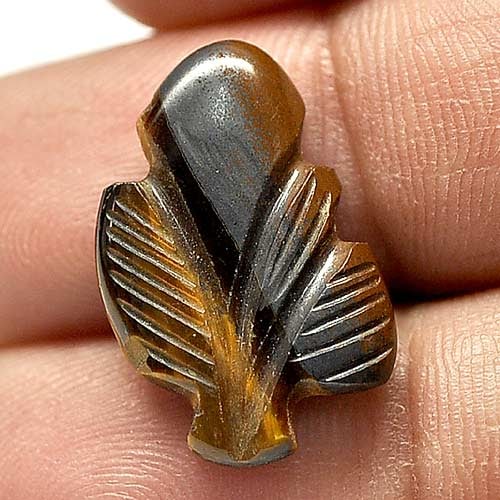 Natural Multi-Color Yellow Golden Tiger Eye Gemstones 9.78 Ct. Carving Leaves Shape 21 x 15.2 Mm.: Product ID: 811600129 Product Name: Natural Tiger eye Weight: 9.78 CT. Size: 21 x 15.2 x 3.8 MM. Shape: Carving Leaves Color: Multi-Color Clarity:Opaque Luster: Good Gems Origin: Thailand Treatment: U
