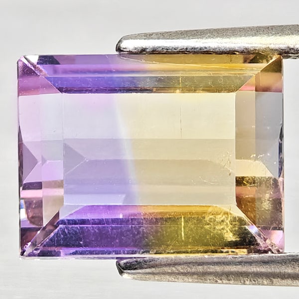 Natural Bi Color Ametrine Gemstones 2.78 Ct. Octagon Shape 9.3 x 7.2 Mm.: Product ID: 800408419 Product Name: Natural Ametrine Weight: 2.78 CT. Size: 9.3 x 7.2 x 5.1 MM. Shape: Octagon Color: Bi Color Clarity:VSI - SI1 Luster: Good Gems Origin: Bolivia Treatment: Unheated C