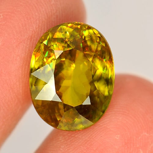 Natural Multi Color Sphene Gemstones 8.34 Ct. Oval Shape 14.1 x 11 Mm.: Product ID: 806507455 Product Name: Natural Sphene Weight: 8.34 CT. Size: 14.1 x 11 x 6.8 MM. Shape: Oval Color: Multi Color With Rainbow Clarity:VVS Luster: Adamantine Gems Origin: Madagascar Treatme