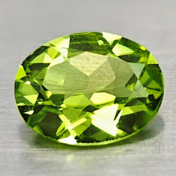 Natural Green Peridot Gemstones 1.67 Ct. Oval Shape 6.9 x 8.9 Mm.: Product ID: 805316947 Product Name: Natural Peridot Weight: 1.67 CT. Size: 6.9 x 8.9 x 3.9 MM. Shape: Oval Color: Green Clarity:VSI Luster: Good Gems Origin: Pakistan Treatment: Unheated Crystal Struc