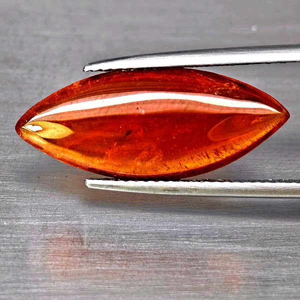 Natural Orangish Red Spessartine Garnet Gemstones 8.24 Ct. Marquise Shape Cabochon: Product ID: 802938001 Product Name: Natural Garnet Weight: 8.24 CT. Size: 20.3 x 19.7 x 3.8 MM. Shape: Marquise Cabochon Color: Orangish Red Clarity:SI1 Luster: Good Gems Origin: Namibia Treatment: Un