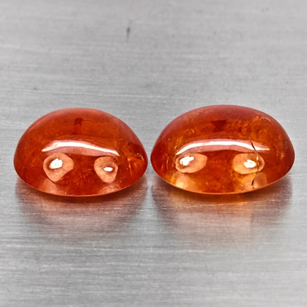 Natural Orangish Red Spessartine Garnet Gemstones 16.41 Ct. 2 Pcs Oval Cabochon Shape Mixed Size: Product ID: 802937988 Product Name: Natural Garnet Weight: 16.41 CT. Size: 13 x 9.8 x 6.6 to 12.1 x 10.2 x MM. Shape: Oval Cabochon Color: Orangish Red Clarity:SI1 Luster: Good Gems Origin: Namibia Tr