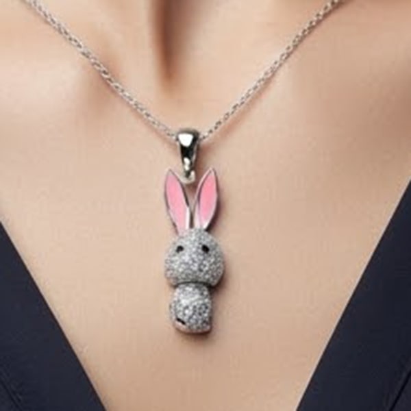 925 Sterling Silver Rabbit Design White Golde Plated Pendant: Product ID: 281330009 Product Name: Natural Fashion Jewelry Weight: 3.42 CT. Size: 35 x 9.3 Mm. MM. Shape: Rabbit Color: Pink Clarity:None Luster: Good Gems Origin: Thailand Treatment: None Crystal St