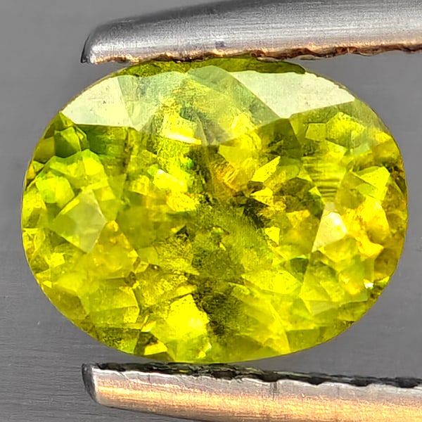 Natural Multi-Color With Rainbow Spark Sphene Gemstones 1.21 Ct. Oval Shape 7.4 x 6 Mm.: Product ID: 806509308 Product Name: Natural Sphene Weight: 1.21 CT. Size: 7.4 x 6 x 3.8 MM. Shape: Oval Color: Multi-Color Clarity:SI1 Luster: Good Gems Origin: Madagascar Treatment: Unheated Crystal 