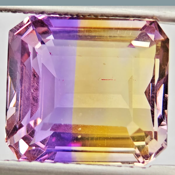Natural Bi Color Ametrine Gemstones 7.01 Ct. Octagon Shape 11.8 x 10.7 Mm.: Product ID: 800408584 Product Name: Natural Ametrine Weight: 7.01 CT. Size: 11.8 x 10.7 x 7.1 MM. Shape: Octagon Color: Bi Color Clarity:VSI Luster: Good Gems Origin: Bolivia Treatment: Unheated Cryst