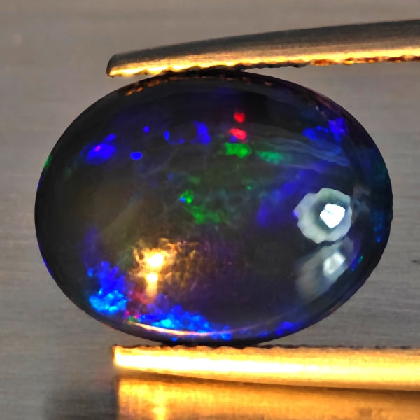 Natural Multi Color Play Of Color Rainbow Opal Gemstones 2.19 Ct. Oval Cabochon Shape 12.2 x 9.5 Mm.: Product ID: 818728613 Product Name: Natural Opal Weight: 2.19 CT. Size: 12.2 x 9.5 x 4.5 MM. Shape: Oval Cabochon Color: Multi-Color Clarity:Semi - Transparent Luster: Good Gems Origin: Ethiopia Treat