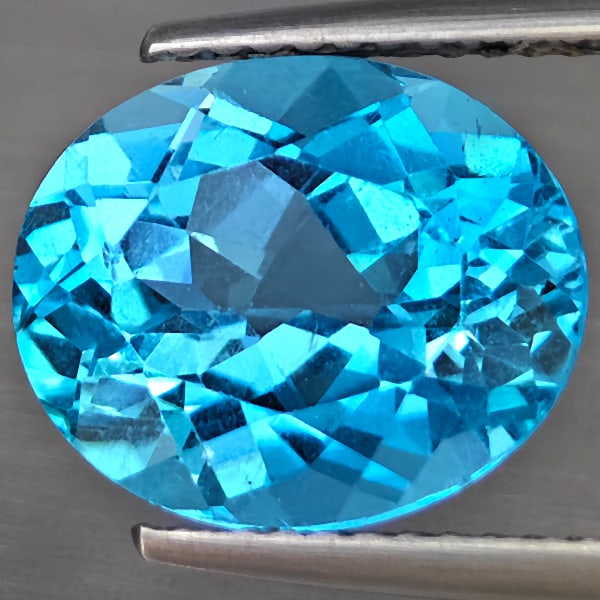 Natural Swiss Blue Topaz Gemstones 6.17 Ct. Oval Shape 12.1 x 10.1 Mm.: Product ID: 807169029 Product Name: Natural Blue Topaz Weight: 6.17 CT. Size: 12.1 x 10.1 x 7 MM. Shape: Oval Shape Color: Swiss Blue Clarity:VSI Luster: Good Gems Origin: Brazil Treatment: Treated Cr