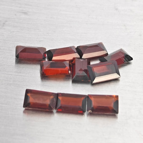 Natural Orangish Red Garnet Gemstones 3.05 Ct. 10 Pcs. Baguette Shape 5.1 x 3 Mm.: Product ID: 802937897 Product Name: Natural Red Garnet Weight: 3.05 CT. Size: 5.1 x 3 x 2.2 MM. Shape: Baguette Shape Color: Orangish Red Clarity:SI1 Luster: Good Gems Origin: Tanzania Treatment: Unhe