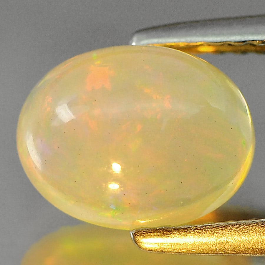 Natural Multi Color Opal Gemstones 1.66 Ct. Oval Cabochon Shape 9 x 7 Mm.: Product ID: 818725160 Product Name: Natural Opal Weight: 1.66 CT. Size: 9 x 7 x 5 MM. Shape: Oval Cabochon Color: Multi-Color Clarity:Semi - Transparent Luster: Iridescent Gems Origin: Ethiopia Treatm
