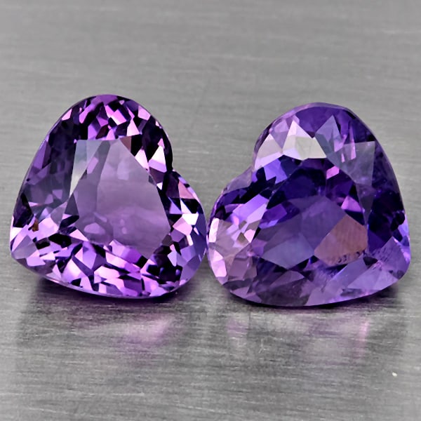 Natural Purple Amethyst Gemstones 6.32 Ct. 2 Pcs. Heart Shape 10 x 9.3 Mm.: Product ID: 800325610 Product Name: Natural Amethyst Weight: 6.32 CT. Size: 10 x 9.3 x 6.4 MM. Shape: Heart Shape Color: Purple Clarity:VVS Luster: Very Good Gems Origin: Brazil Treatment: Unheated Cr