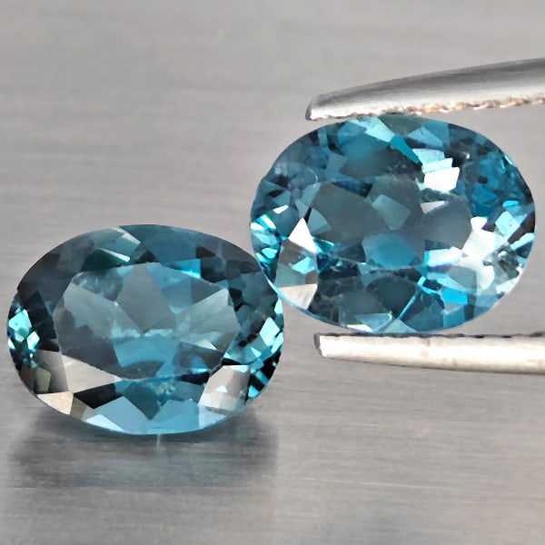 Natural London Blue Topaz Gemstones 3.97 Ct. 2 Pcs. Oval Shape 9.1 x 7.1 Mm.: Product ID: 807168890 Product Name: Natural Blue Topaz Weight: 3.97 CT. Size: 9.1 x 7.1 x 4.5 MM. Shape: Oval Color: London Blue Clarity:SI1 Luster: Good Gems Origin: Brazil Treatment: Treated Crystal