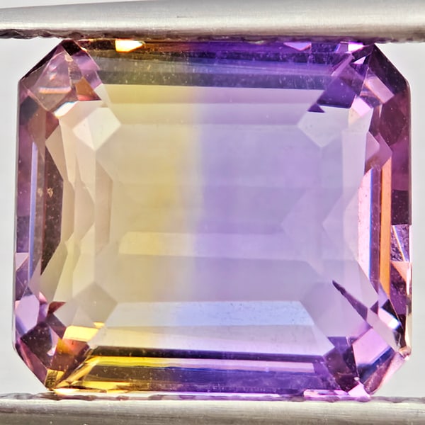Natural Bi Color Ametrine Gemstones 5.11 Ct. Octagon Shape 10.6 x 9.5 Mm.: Product ID: 800408578 Product Name: Natural Ametrine Weight: 5.11 CT. Size: 10.6 x 9.5 x 5.8 MM. Shape: Octagon Color: Bi Color Clarity:VSI Luster: Good Gems Origin: Bolivia Treatment: Unheated Crysta