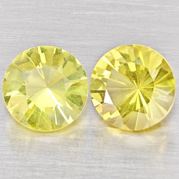 Natural Yellow Lemon Quartz Gemstones 3.44 Ct. 2 Pcs. Round Diamond Cut 8.2 Mm.: Product ID: 805530159 Product Name: Natural Quartz Weight: 3.44 CT. Size: 8.2 x 8.2 x 5.7 MM. Shape: Round Diamond Cut Color: Yellow Lemon Clarity:VSI Luster: Good Gems Origin: Brazil Treatment: Unhea