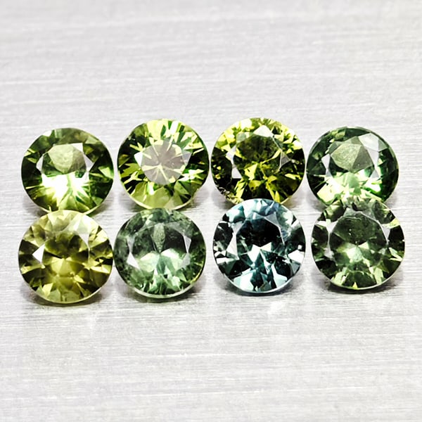 Natural Green Sapphire Gemstones 0.65 Ct. 8 Pcs. Round Diamond Cut 2.6 Mm.: Product ID: 806162485 Product Name: Natural Green Sapphire Weight: 0.65 CT. Size: 2.6 x 2.6 x 1.9 MM. Shape: Round Diamond Cut Color: Green Clarity:VSI Luster: Good Gems Origin: Thailand Treatment: He