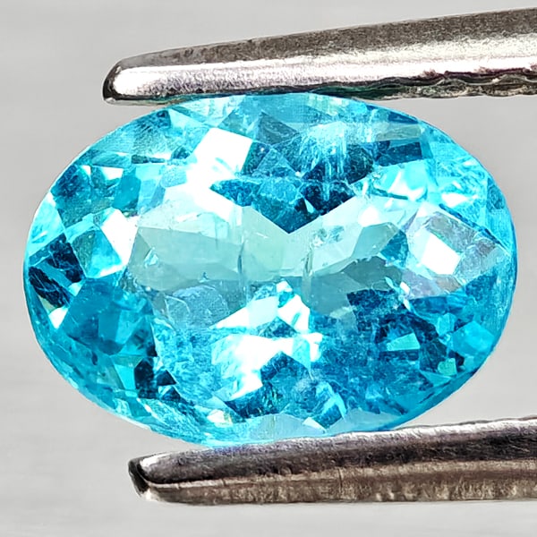 Natural Paraiba Color Apatite Gemstones 0.82 Ct. Oval Shape 7 x 5.2 Mm.: Product ID: 800613707 Product Name: Natural Apatite Weight: 0.82 CT. Size: 7 x 5.2 x 3.5 MM. Shape: Oval Color: Neon Blue Clarity:VSI Luster: Good Gems Origin: Tanzania Treatment: Unheated Crystal Str