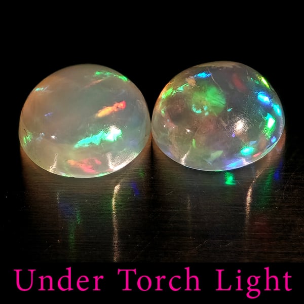 Natural Multi Color Opal Gemstones 1.66 Ct. 2 Pcs. Round Cabochon Shape 6.9 Mm.: Product ID: 818728166 Product Name: Natural Opal Weight: 1.66 CT. Size: 6.9 x 6.9 x 3.5 MM. Shape: Round Color: Multi-Color Clarity:Semi - Transparent Luster: Good Gems Origin: Ethiopia Treatment: Unh