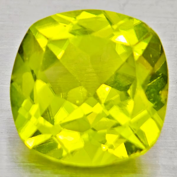 Natural Green Peridot Gemstones 1.46 Ct. Cushion Shape 7.1 Mm.: Product ID: 805317246 Product Name: Natural Peridot Weight: 1.46 CT. Size: 7.1 x 7.1 x 4.1 MM. Shape: Cushion Shape Color: Green Clarity:VSI - SI1 Luster: Good Gems Origin: Pakistan Treatment: Unheate