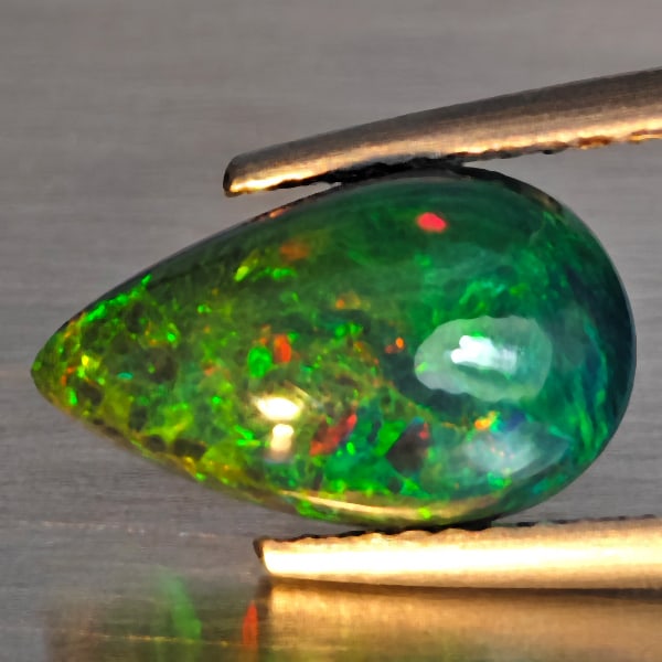 Natural Multi Color Play Of Color Rainbow Opal Gemstones 1.44 Ct. Pear Cabochon Shape 11.2 x 7.2 Mm.: Product ID: 818728639 Product Name: Natural Opal Weight: 1.44 CT. Size: 11.2 x 7.2 x 4.4 MM. Shape: Pear Cabochon Color: Multi-Color Clarity:Semi - Transparent Luster: Good Gems Origin: Ethiopia Treat