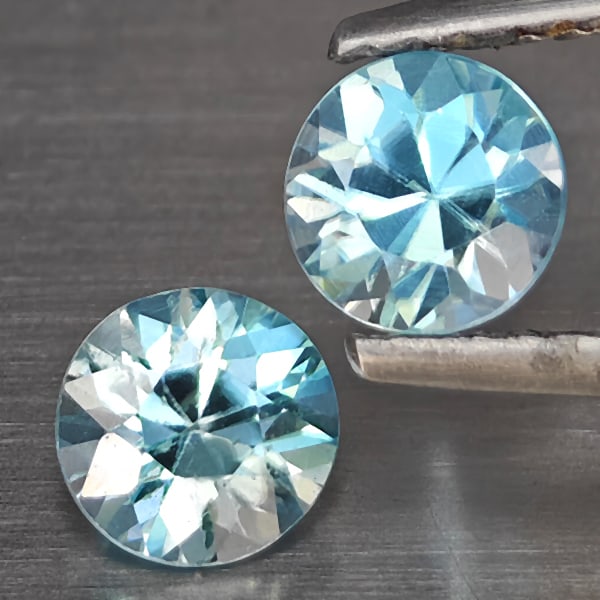 Natural Blue Zircon Gemstones 1.34 Ct. 2 Pcs. Round Diamond Cut 5.1 Mm.: Product ID: 807743200 Product Name: Natural Gemstones Weight: 1.34 CT. Size: 5.1 x 5.1 x 3.5 MM. Shape: Round Diamond Cut Color: Blue Clarity:SI1 Luster: Good Gems Origin: Cambodia Treatment: Heated C