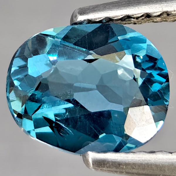 Natural London Blue Topaz Gemstones 1.08 Ct. Oval Shape 7.1 x 5.8 Mm.: Product ID: 807169037 Product Name: Natural Blue Topaz Weight: 1.08 CT. Size: 7.1 x 5.8 x 3.6 MM. Shape: Oval Color: London Blue Clarity:SI1 Luster: Good Gems Origin: Brazil Treatment: Treated Crystal