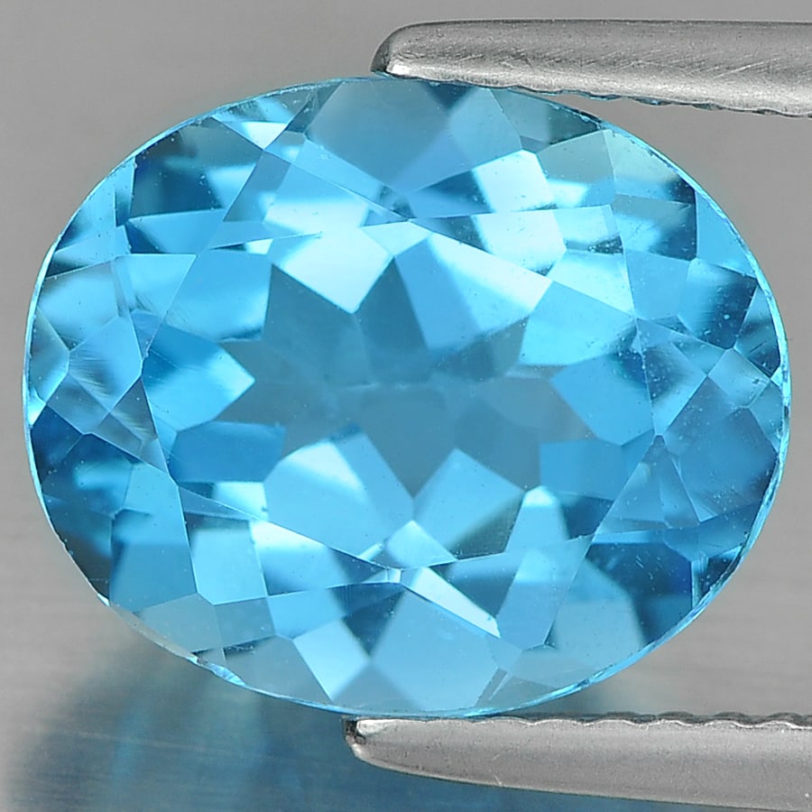 Natural Swiss Blue Topaz Gemstones 5.23 Ct. Oval Shape 12 x 10 Mm.: Product ID: 807161126 Product Name: Natural Blue Topaz Weight: 5.23 CT. Size: 12 x 10 x 6.3 MM. Shape: Oval Color: Blue Clarity:VVS Luster: Good Gems Origin: Brazil Treatment: Treated Crystal Structur