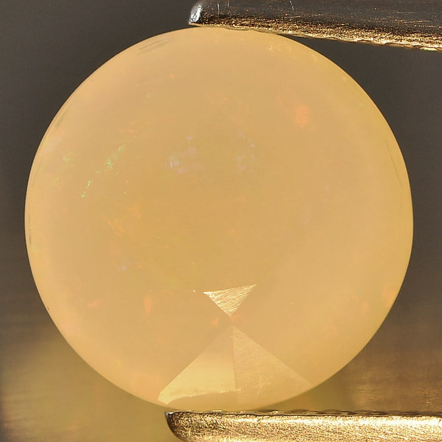 Natural Multi Color Opal Gemstones 2.58 Ct. Round Shape 10.3 Mm.: Product ID: 818711525 Product Name: Natural Opal Weight: 2.58 CT. Size: 10.3 x 10.3 x 6 MM. Shape: Round Color: Multi Color Clarity:Semi - Transparent Luster: Good Gems Origin: Ethiopia Treatment: Unh
