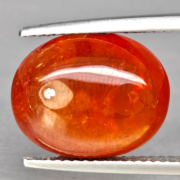 Natural Orange Spessartine Garnet Gemstones 11.15 Ct. Oval Cabochon Shape 14.4 x 11.7 Mm.: Product ID: 802938027 Product Name: Natural Garnet Weight: 11.15 CT. Size: 14.4 x 11.7 x 6.4 MM. Shape: Oval Cabochon Color: Orangish Red Clarity:SI1 Luster: Good Gems Origin: Namibia Treatment: Unhea