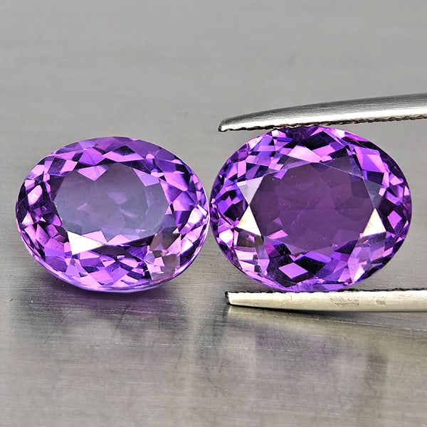Natural Purple Amethyst Gemstones 9.30 Ct. 2 Pcs. Oval Shape 11.8 x 9.9 Mm.: Product ID: 800325680 Product Name: Natural Amethyst Weight: 9.30 CT. Size: 11.8 x 9.9 x 7 MM. Shape: Oval Shape Color: Purple Clarity:VSI Luster: Good Gems Origin: Brazil Treatment: Unheated Crystal 