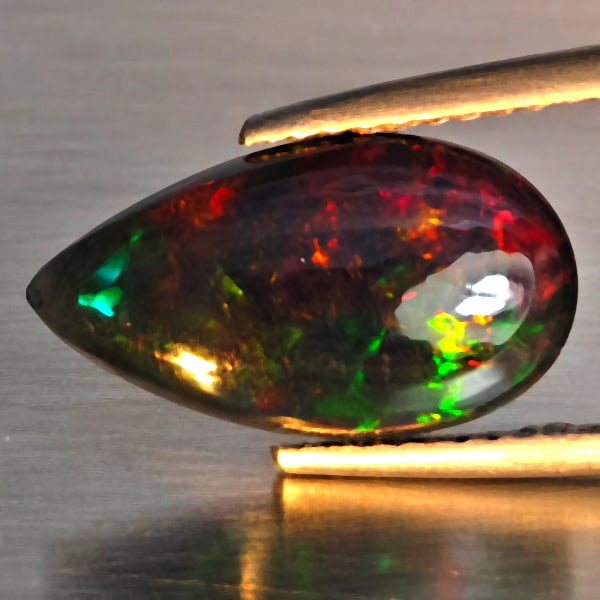 Natural Multi Color Play Of Color Rainbow Opal Gemstones 1.71 Ct. Pear Cabochon Shape 14.9 x 8.4 Mm.: Product ID: 818728648 Product Name: Natural Opal Weight: 1.71 CT. Size: 14.9 x 8.4 x 3.2 MM. Shape: Pear Cabochon Color: Multi-Color Clarity:Semi - Transparent Luster: Good Gems Origin: Ethiopia Treat