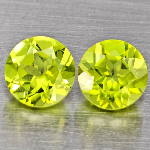 Natural Green Peridot Gemstones 1.45 Ct. 2 Pcs. Round Shape 5.2 Mm.: Product ID: 805317610 Product Name: Natural Peridot Weight: 1.45 CT. Size: 5.2 x 5.2 x 3.4 MM. Shape: Round Color: Green Clarity:VSI Luster: Good Gems Origin: Pakistan Treatment: Unheated Crystal Stru