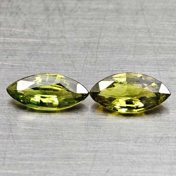 Natural Green Sapphire Gemstones 0.84 Ct. 2 Pcs. Marquise Shape 7 x 3.5 Mm.: Product ID: 806162000 Product Name: Natural Green Sapphire Weight: 0.84 CT. Size: 7 x 3.5 x 2.2 MM. Shape: Marquise Shape Color: Green Clarity:VSI Luster: Good Gems Origin: Thailand Treatment: Heated 