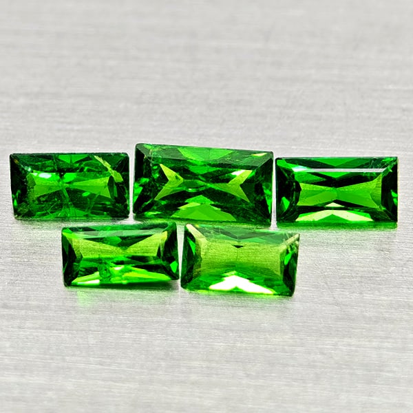 Natural Green Tsavorite Garnet Gemstones 0.67 Ct. 5 Pcs. Baguette Shape 3.8 x 1.9 Mm.: Product ID: 803005053 Product Name: Natural Tsavorite Weight: 0.67 CT. Size: 3.8 x 1.9 x 1.2 to 4.7 x 2.4 x 1.9 MM. Shape: Baguette Color: Green Clarity:SI1 Luster: Good Gems Origin: Tanzania Treatmen