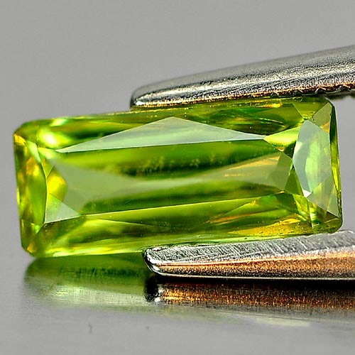Natural Green Titanium Sphene Gemstones With Rainbow Spark 0.84 Ct. Octagon Shape 8.4 x 3.8 Mm.: Product ID: 806507196 Product Name: Natural Sphene Weight: 0.84 CT. Size: 8.4 x 3.8 x 2.6 MM. Shape: Octagon Color: Green With Rainbow Spark Clarity:SI1 Luster: Adamantine Gems Origin: Madagascar Trea