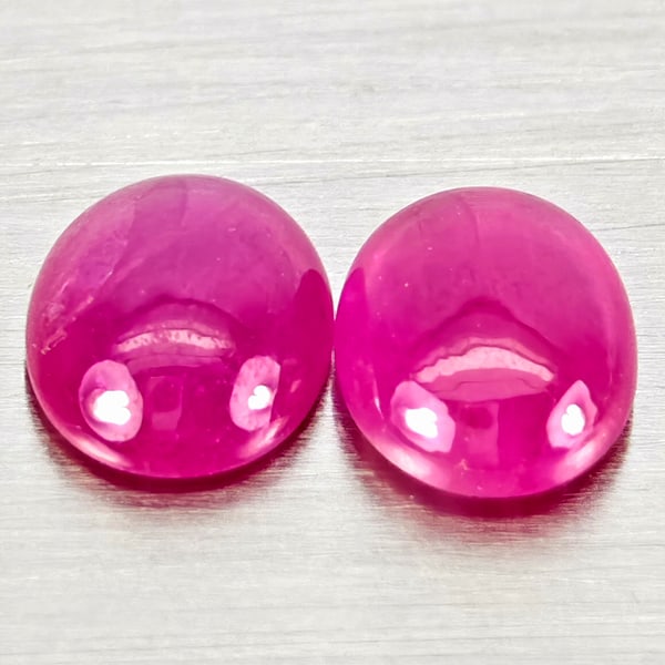 Natural Pink Red Jonson Ruby Gemstones 0.81 Ct. 2 Pcs. Oval Cabochon Shape 5 x 4.2 Mm.: Product ID: 805935782 Product Name: Natural Ruby Weight: 0.81 CT. Size: 5 x 4.2 x 2 MM. Shape: Oval Cabochon Color: Pink Red Clarity:Semi - Transparent Luster: Good Gems Origin: Mozambique Treatment: 