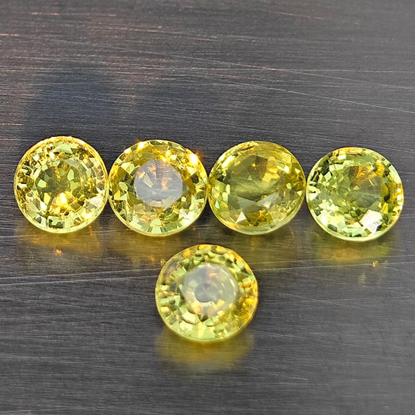 Natural Greenish Yellow Titanium Sphene Rainbow Spark 1.47 Ct. 5 Pcs. Round Shape 3.9 Mm.: Product ID: 806509401 Product Name: Natural Sphene Weight: 1.47 CT. Size: 3.9 x 3.9 x 2.4 MM. Shape: Round Color: Greenish Yellow Clarity:SI1 Luster: Good Gems Origin: Madagascar Treatment: Unheated C