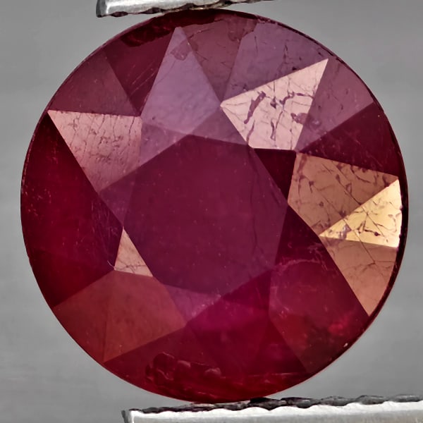 Natural Purplish Red Ruby Gemstones 4.66 Ct. Round Shape 10 Mm.: Product ID: 805935950 Product Name: Natural Ruby Weight: 4.66 CT. Size: 10 x 10 x 5.3 MM. Shape: Round Shape Color: Purplish Red Clarity:SI1 Luster: Good Gems Origin: Madagascar Treatment: Heated (Lea