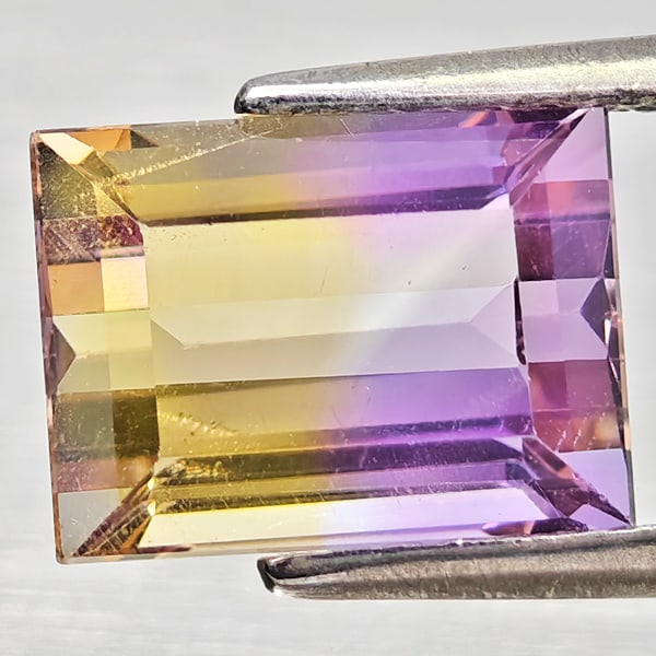 Natural Bi Color Ametrine Gemstones 2.81 Ct. Octagon Shape 9.2 x 6.9 Mm.: Product ID: 800408395 Product Name: Natural Ametrine Weight: 2.81 CT. Size: 9.2 x 6.9 x 5.6 MM. Shape: Octagon Color: Bi Color Clarity:VSI - SI1 Luster: Good Gems Origin: Bolivia Treatment: Unheated C