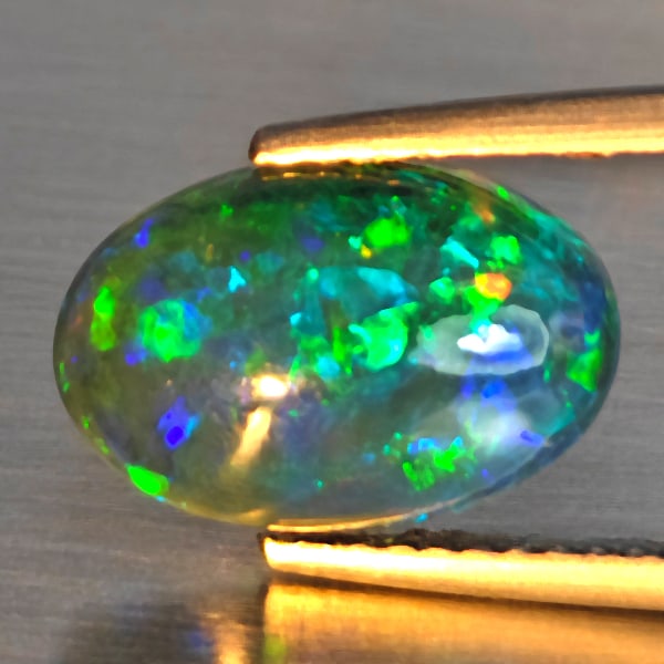 Natural Multi Color Play Of Color Rainbow Opal Gemstones 2.16 Ct. Oval Cabochon Shape 12.6 x 8.4 Mm.: Product ID: 818728652 Product Name: Natural Opal Weight: 2.16 CT. Size: 12.6 x 8.4 x 4.8 MM. Shape: Oval Cabochon Color: Multi-Color Clarity:Semi - Transparent Luster: Good Gems Origin: Ethiopia Treat