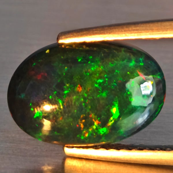 Natural Multi Color Play Of Color Rainbow Opal Gemstones 1.58 Ct. Oval Cabochon Shape 12.4 x 8.4 Mm.: Product ID: 818728654 Product Name: Natural Opal Weight: 1.58 CT. Size: 12.4 x 8.4 x 3.2 MM. Shape: Oval Cabochon Color: Multi-Color Clarity:Semi - Transparent Luster: Good Gems Origin: Ethiopia Treat