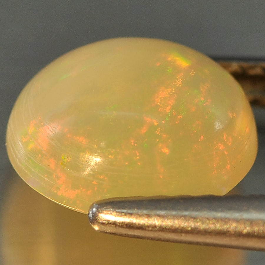 Natural Multi Color Opal Gemstones 1.78 Ct. Oval Cabochon Shape 8.9 x 8 Mm.: Product ID: 818709182 Product Name: Natural Opal Weight: 1.78 CT. Size: 8.9 x 8 x 4.9 MM. Shape: Oval Cabochon Color: Multi Color Clarity:Opaque Luster: Good Gems Origin: Ethiopia Treatment: Unheated 