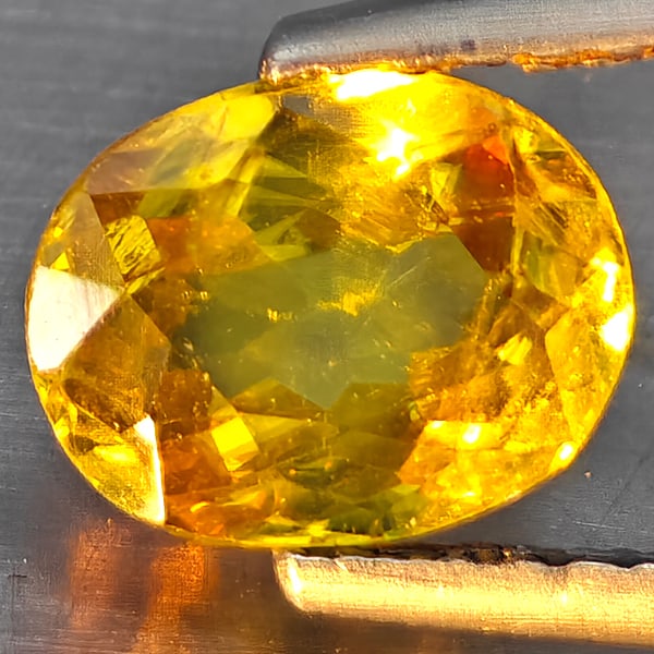 Natural Multi-Color With Rainbow Spark Sphene Gemstones 1.23 Ct. Oval Shape 7.6 x 6 Mm.: Product ID: 806509100 Product Name: Natural Sphene Weight: 1.23 CT. Size: 7.6 x 6 x 3.6 MM. Shape: Oval Shape Color: Multi-Color Clarity:SI1 Luster: Good Gems Origin: Madagascar Treatment: Unheated Cr